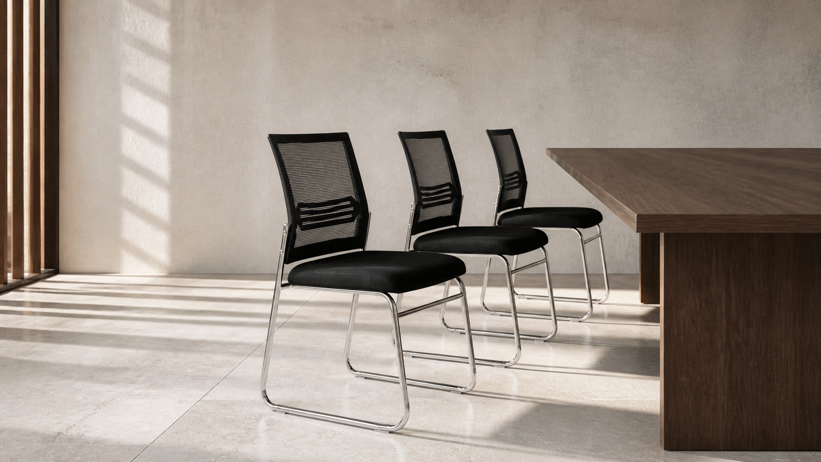 Three ADORN 818-E mesh conference chairs beside a walnut table in a sunlit interior